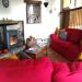 Living room with comfy sofas and a woodburner