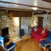 The comfortably furnished lounge area <br>Lounge area with TV, wifi, and woodburner.