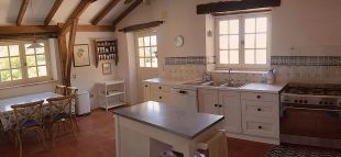 Spacious sunny kitchen with door to larger terrace