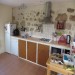 open keuken met koelkast, afwasmachine en oven