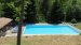 Het zwembad van 10 x 15 meter. <br>Bij het zwembad zijn ligstoelen, een gezellig zitje, een peuterbadje, een pingpong tafel en voetbalspel.