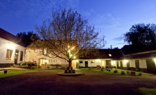 Looking across the courtyard as twilight descends on the gitês.