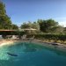 Swimming pool <br>Swimming pool with the pergola sheltering tables and chairs