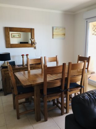 The dining area with solid oak dining table and chairs seating six.