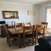 The dining area with solid oak dining table and chairs seating six. 
