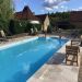 Swimming Pool <br>A photogtaph of the pool looking towards the house and kitchen d’ete.